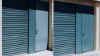 Faded Aqua man door restored with Everbrite Clear Protective Coating.